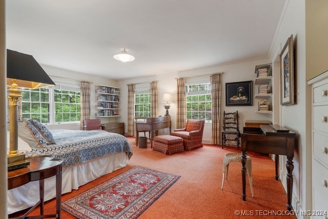 bedroom featuring carpet floors and ornamental molding