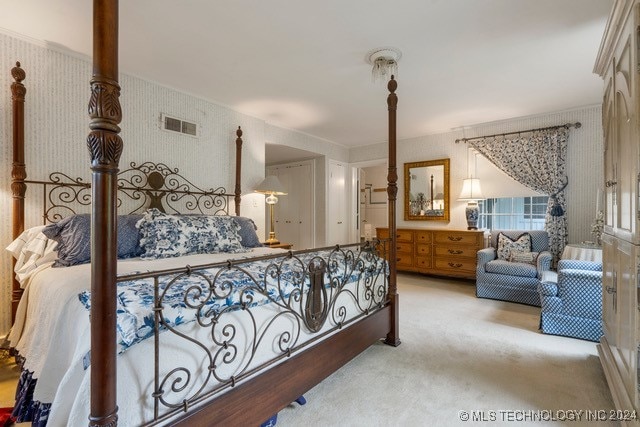 bedroom featuring light colored carpet