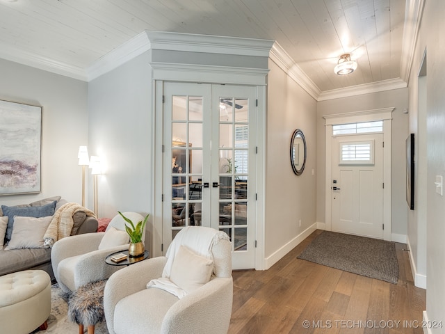 entrance foyer featuring french doors, wood ceiling, ornamental molding, and light hardwood / wood-style flooring