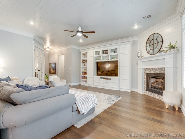 living room featuring hardwood / wood-style flooring, wooden ceiling, a tile fireplace, and ceiling fan