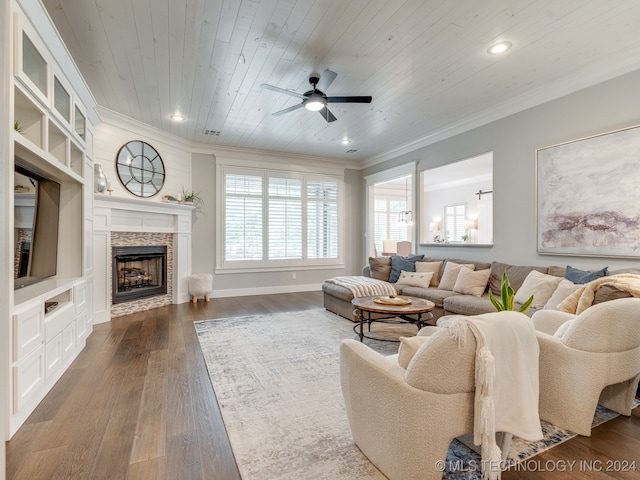 living room with ornamental molding, wood ceiling, dark hardwood / wood-style floors, and ceiling fan