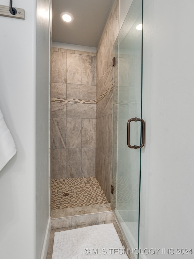 bathroom with an enclosed shower