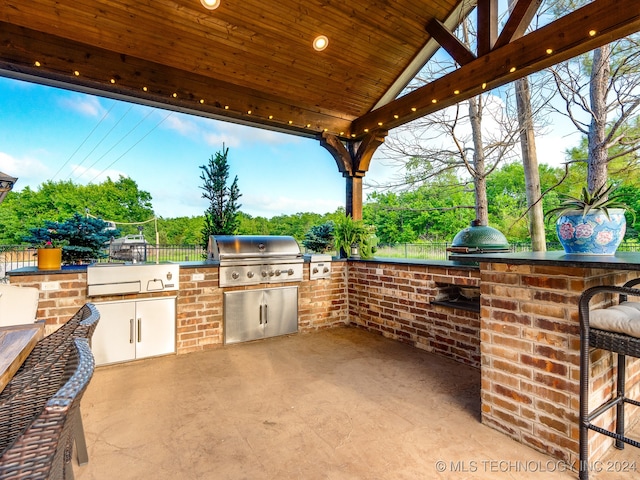 view of patio / terrace with area for grilling and exterior kitchen