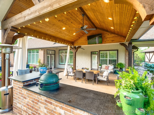 view of patio with an outdoor living space and ceiling fan