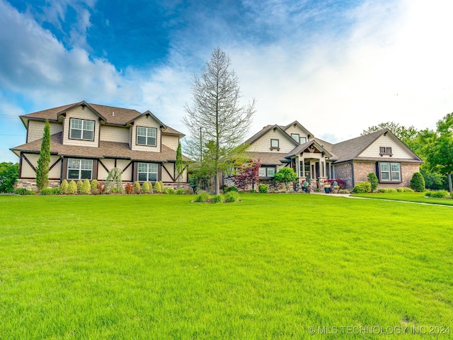 craftsman-style home with a front yard