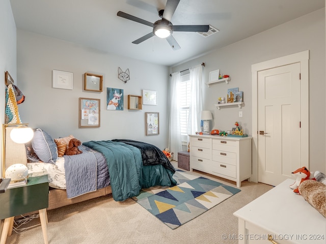 carpeted bedroom with ceiling fan