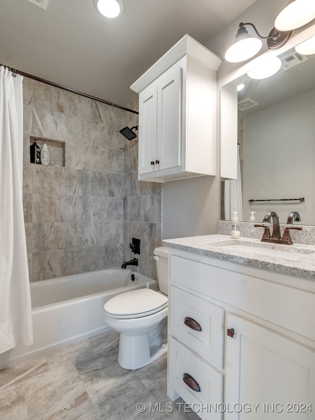 full bathroom featuring vanity, toilet, and shower / tub combo