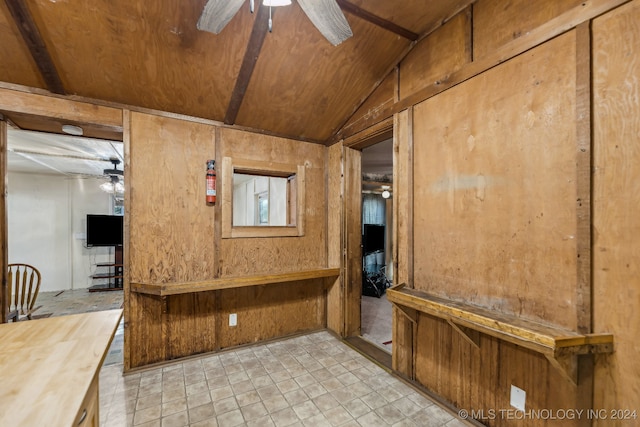 interior space with ceiling fan, wooden ceiling, and vaulted ceiling