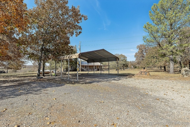 exterior space with a rural view and a carport