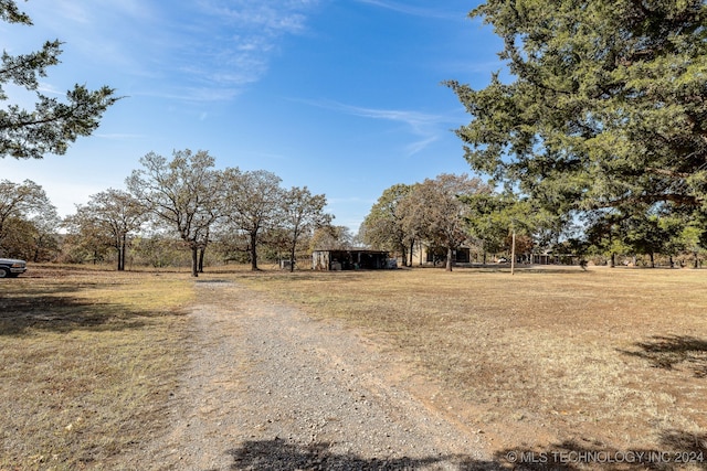 view of yard with a rural view