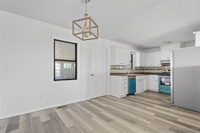 7740 Swayback, Sulphur, OK 73086 - kitchen featuring freestanding refrigerator, range with electric stovetop, dishwashing machine, a textured ceiling, and under cabinet range hood
