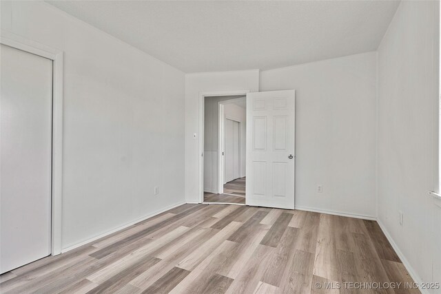 7740 Swayback, Sulphur, OK 73086 - spare room featuring light wood-style flooring and baseboards