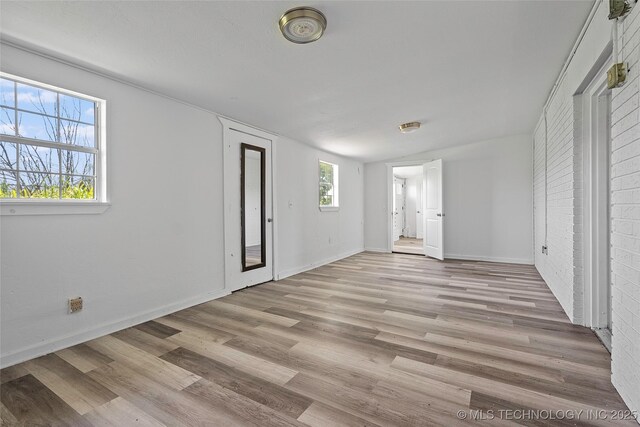 7740 Swayback, Sulphur, OK 73086 - unfurnished bedroom featuring wood finished floors and baseboards