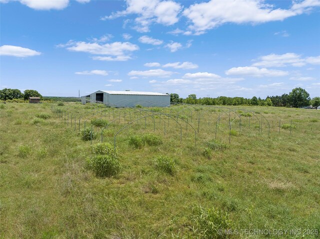7740 Swayback, Sulphur, OK 73086 - view of yard with a view of rural / pastoral area, an outdoor structure, and a pole building