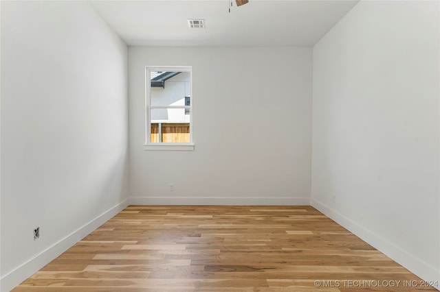 unfurnished room with light hardwood / wood-style flooring