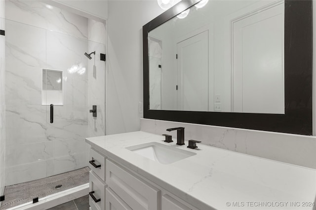 bathroom with vanity, tile patterned floors, and walk in shower