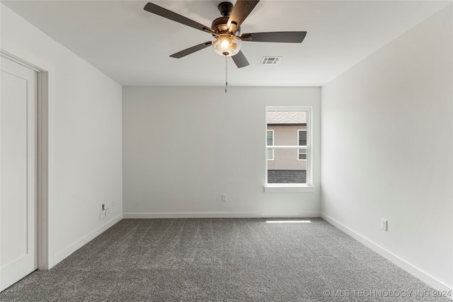 spare room with carpet floors and ceiling fan