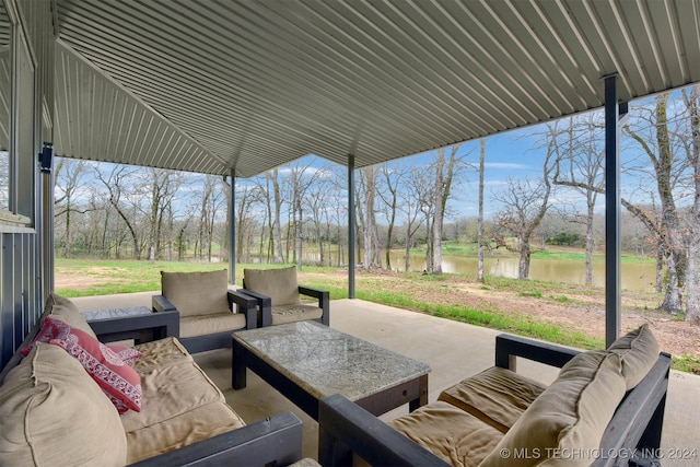 view of patio / terrace with an outdoor living space and a water view