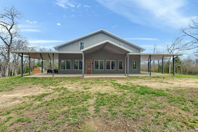 back of property with a carport