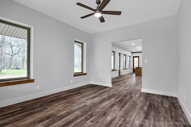 unfurnished room featuring dark hardwood / wood-style flooring and ceiling fan