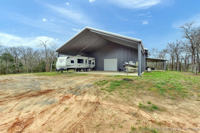 exterior space with a carport