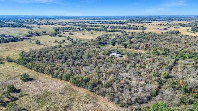 birds eye view of property with a rural view