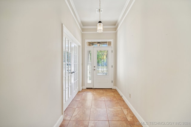 interior space featuring crown molding and light tile patterned floors