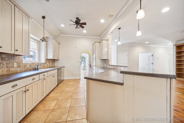 kitchen featuring light tile patterned floors, a healthy amount of sunlight, decorative light fixtures, and dishwasher