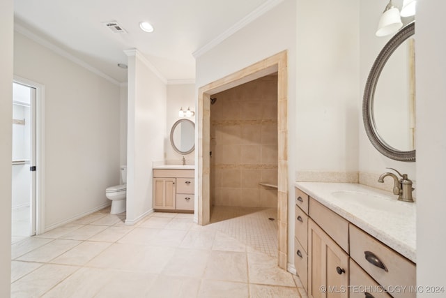 bathroom featuring tiled shower, toilet, tile patterned flooring, ornamental molding, and vanity