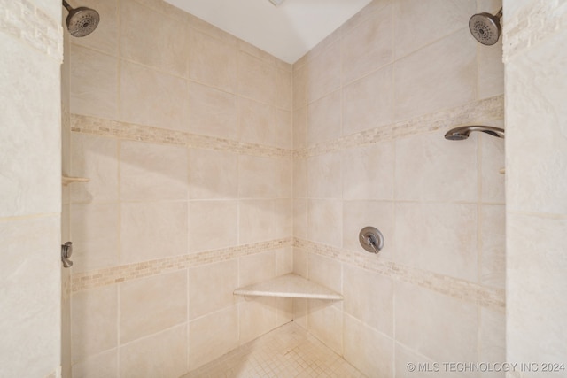 bathroom with tiled shower