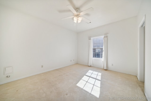 carpeted empty room with ceiling fan