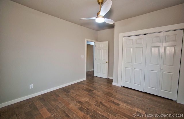 unfurnished bedroom featuring a closet, ceiling fan, and dark wood-type flooring