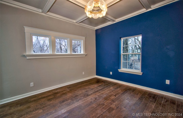 unfurnished room with an inviting chandelier, beam ceiling, and dark wood-type flooring