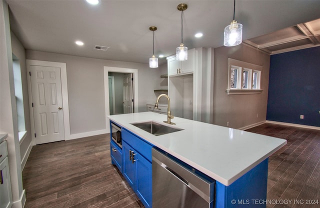 kitchen featuring blue cabinetry, sink, appliances with stainless steel finishes, and pendant lighting