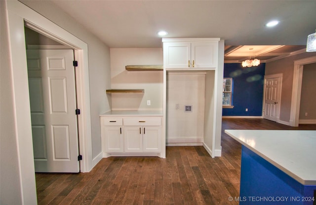 kitchen featuring an inviting chandelier, white cabinets, and dark hardwood / wood-style flooring