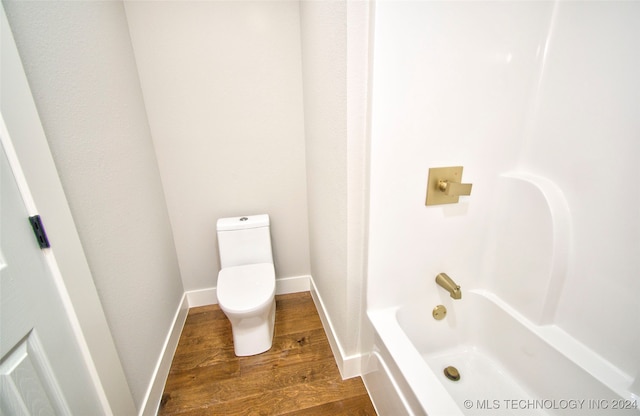 bathroom featuring toilet and wood-type flooring