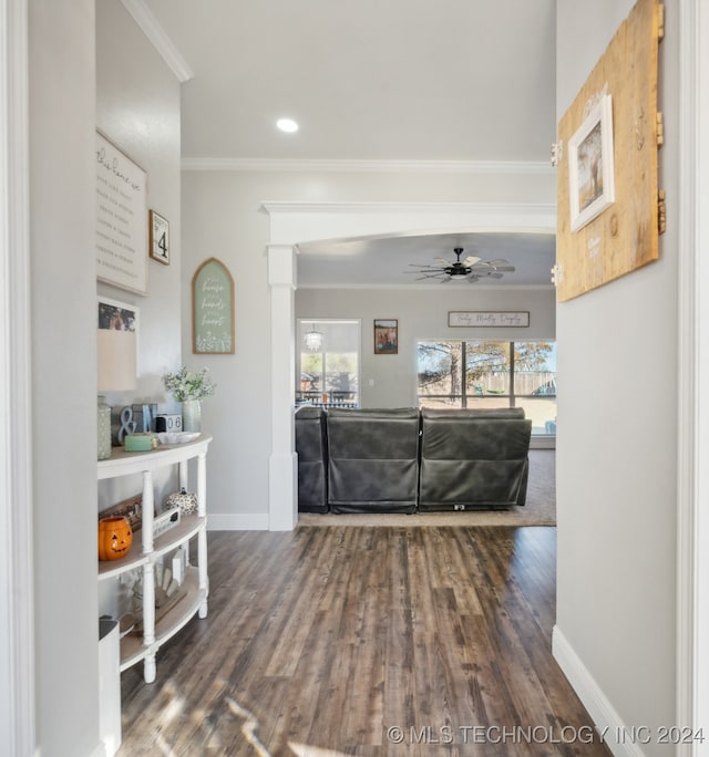 living room featuring ornamental molding, hardwood / wood-style floors, and ceiling fan