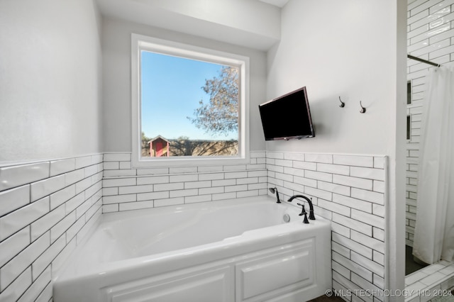 carpeted bedroom featuring ceiling fan and a tray ceiling