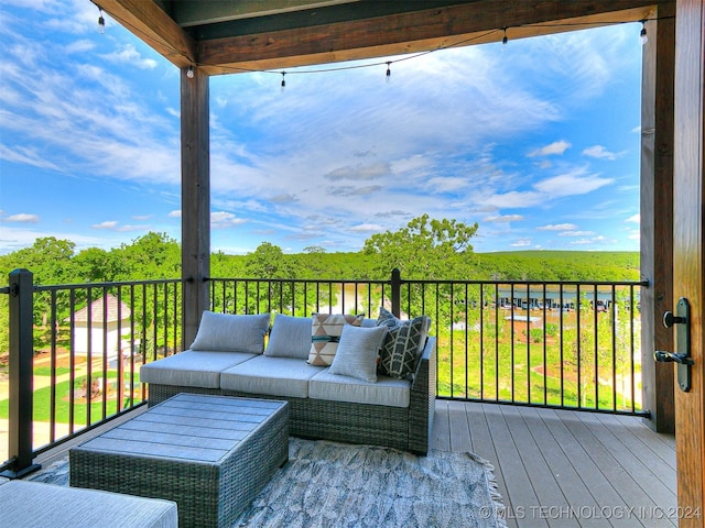 wooden terrace with outdoor lounge area