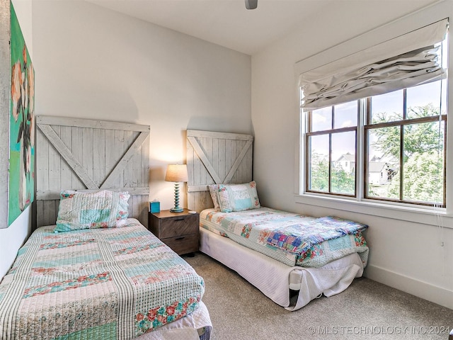 carpeted bedroom with ceiling fan