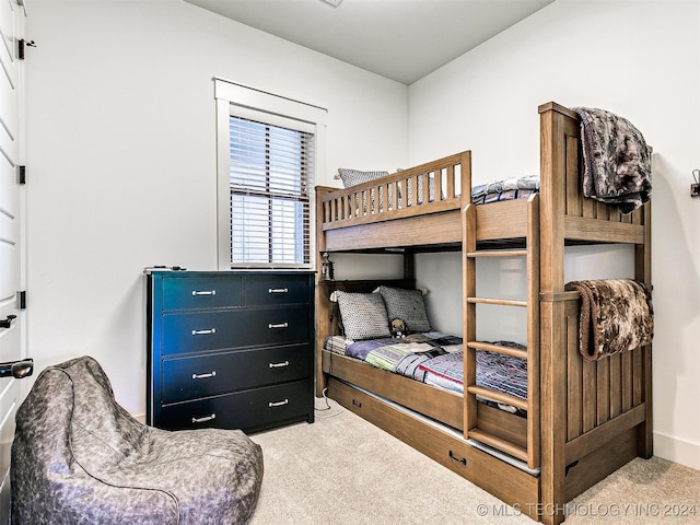 bedroom featuring light carpet