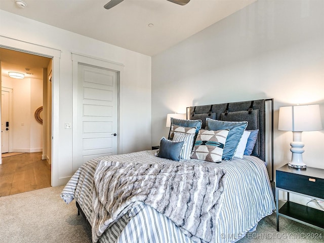 carpeted bedroom with ceiling fan