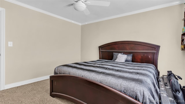 carpeted bedroom featuring crown molding and ceiling fan