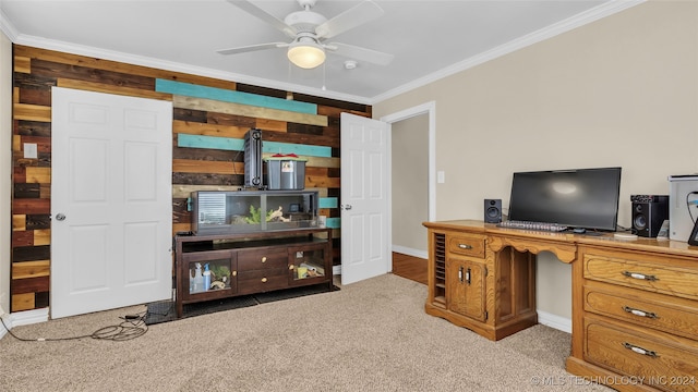 carpeted home office featuring ornamental molding and ceiling fan