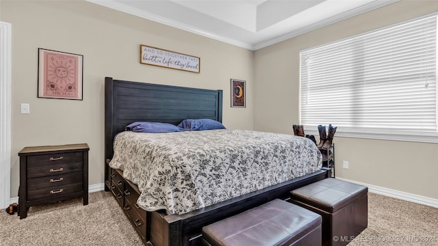 bedroom with ornamental molding and light colored carpet