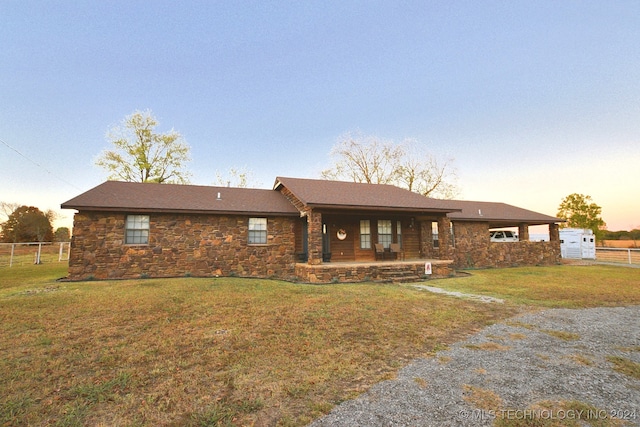 ranch-style house with a lawn