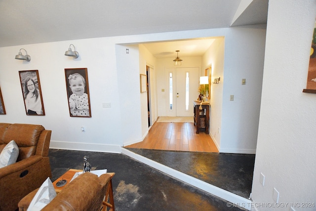 entryway featuring light hardwood / wood-style floors and an inviting chandelier