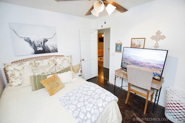 bedroom featuring dark hardwood / wood-style floors and ceiling fan