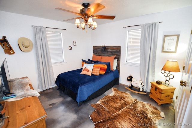 bedroom featuring dark carpet and ceiling fan