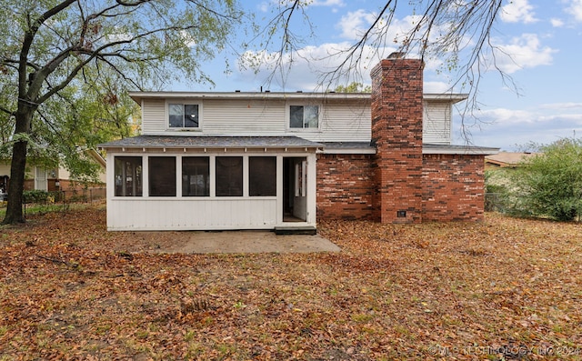 back of property featuring a sunroom